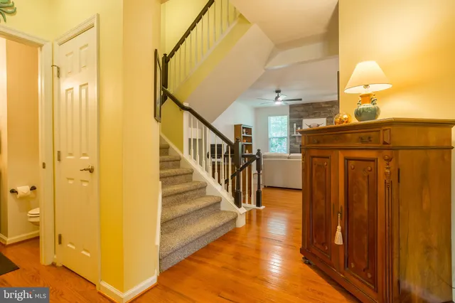 a bathroom with a sink and mirror with toilet