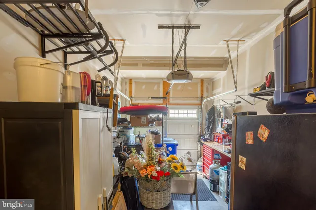 a kitchen with stainless steel appliances granite countertop sink stove and refrigerator
