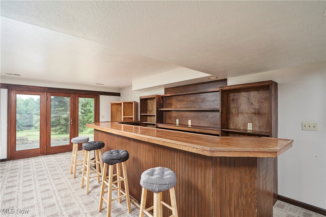 4196 Webb Road Ravenna, OH 44266 - Photo 20 of 29 Basement bar in Family Room with walk out.