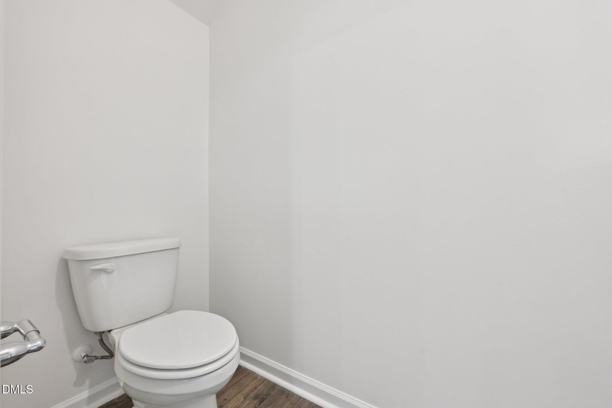 803 Old Tarboro Road Wendell, NC 27591 - Photo 13 of 48 a white toilet sitting next to a white wall