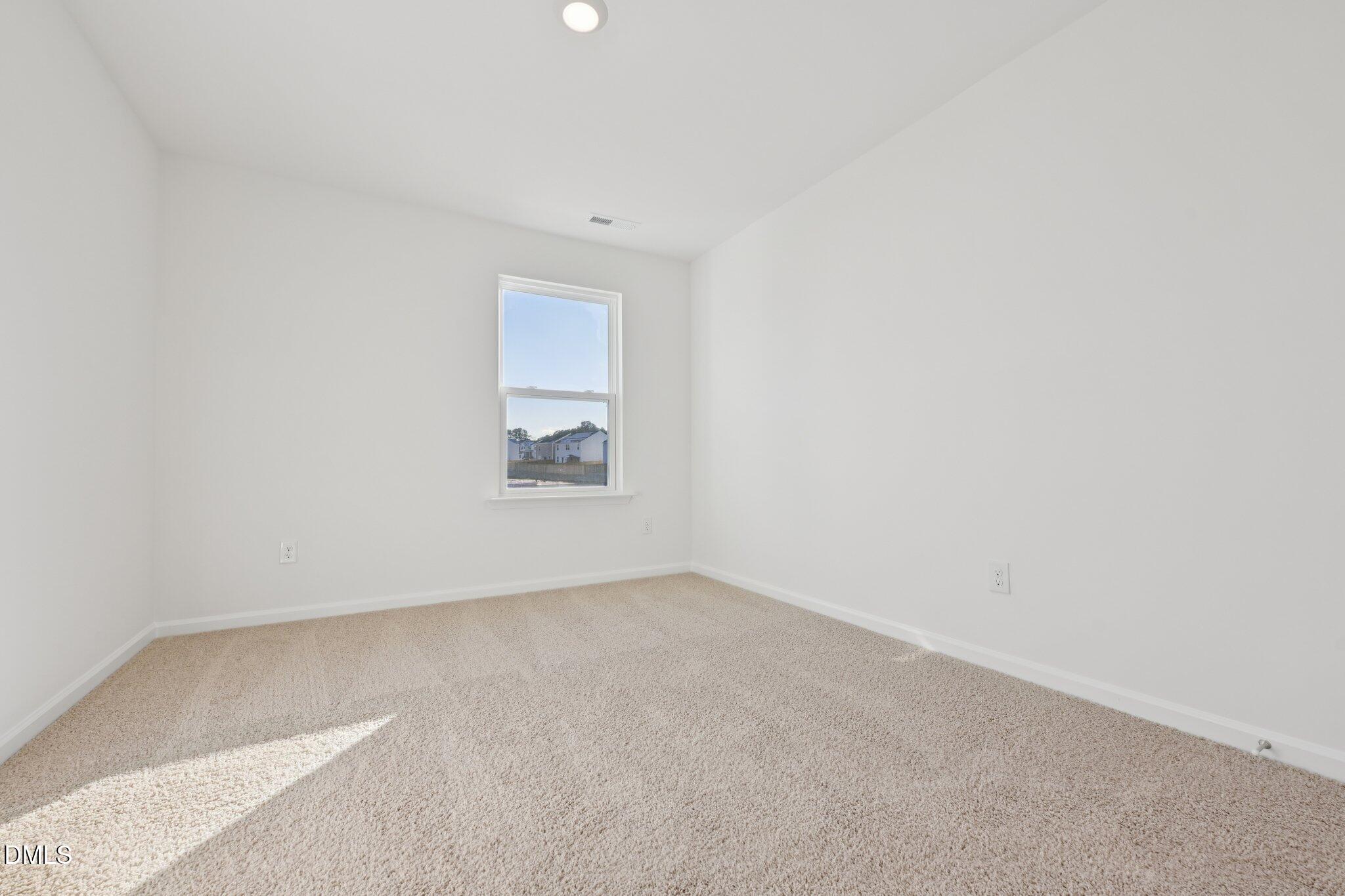 803 Old Tarboro Road Wendell, NC 27591 - Photo 15 of 48 an empty room with a en suite window