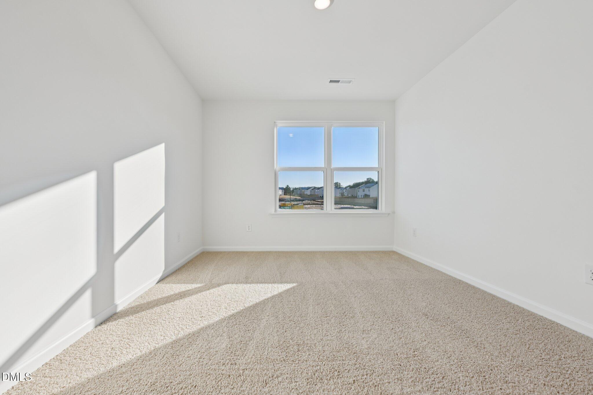 803 Old Tarboro Road Wendell, NC 27591 - Photo 17 of 48 an empty room with windows