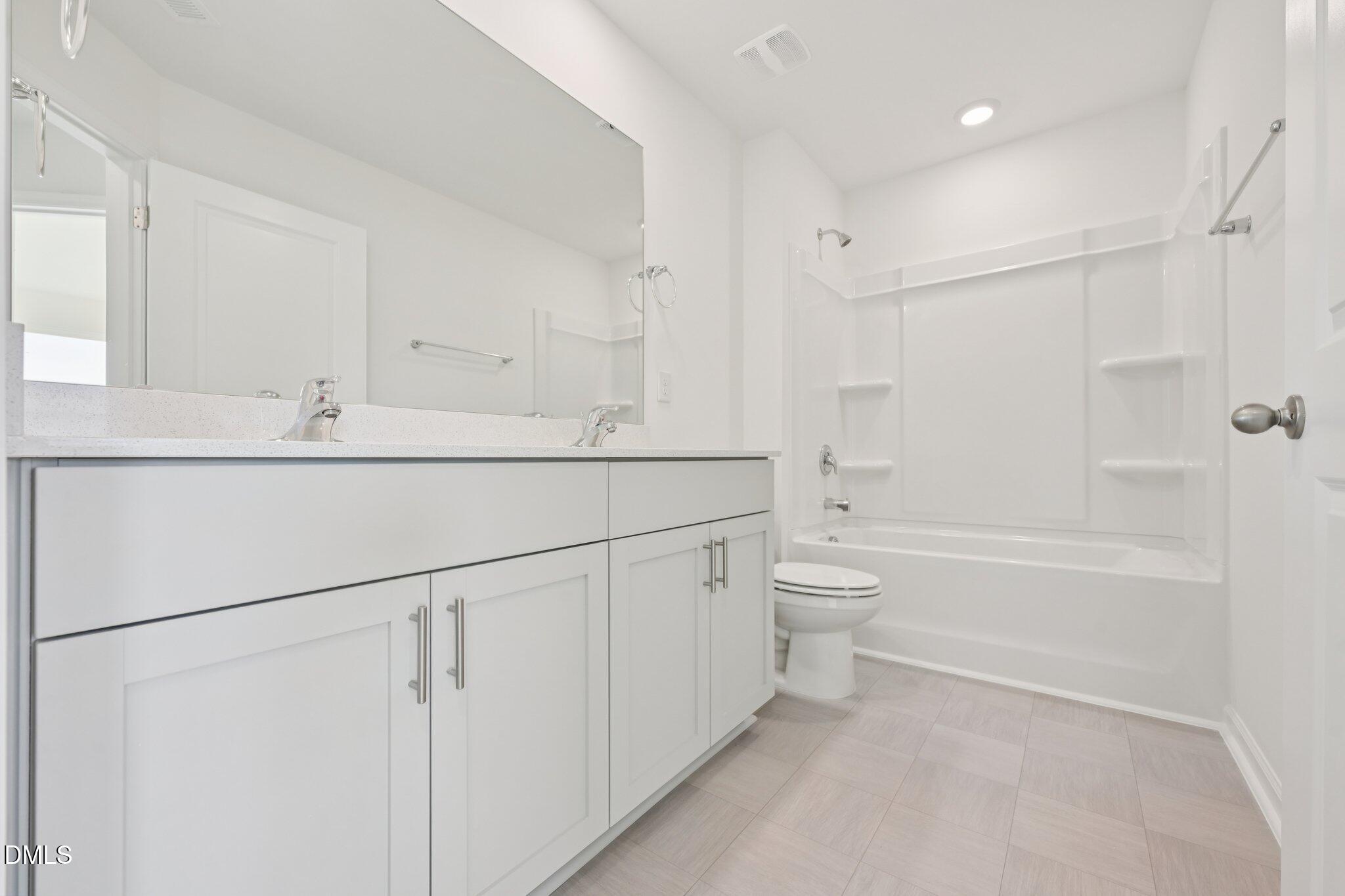 803 Old Tarboro Road Wendell, NC 27591 - Photo 19 of 48 a bathroom with a shower sink and mirror