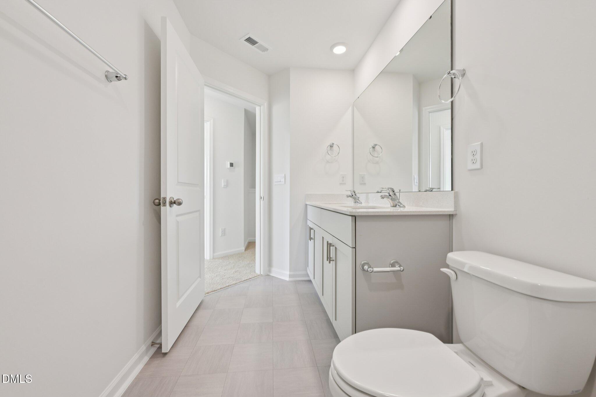 803 Old Tarboro Road Wendell, NC 27591 - Photo 20 of 48 a bathroom with a sink a toilet a tub and a mirror