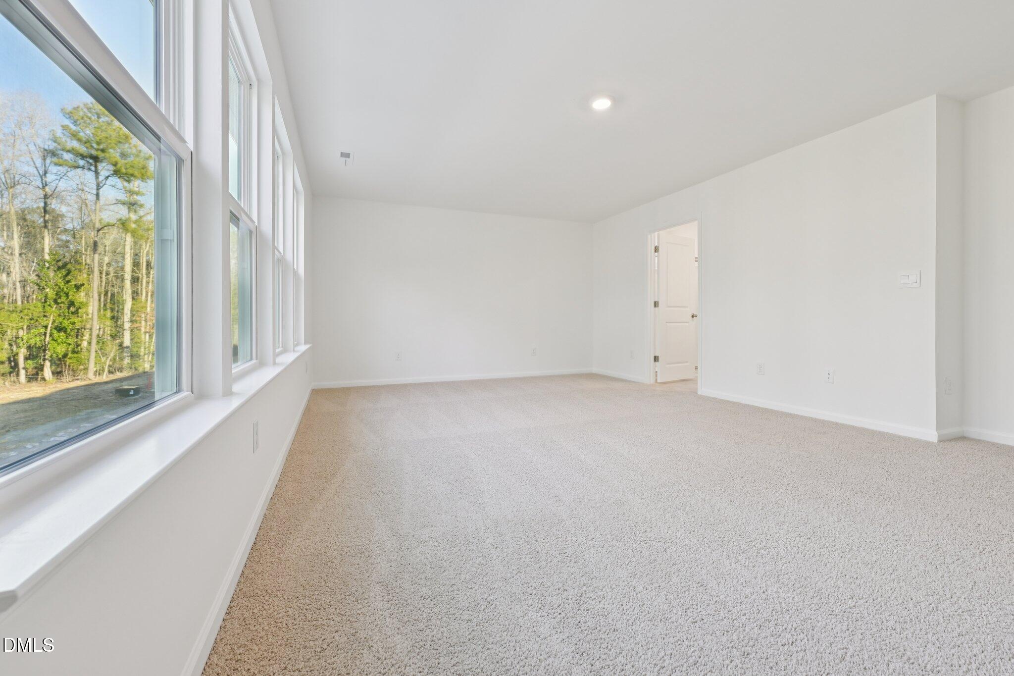 803 Old Tarboro Road Wendell, NC 27591 - Photo 25 of 48 an empty room with windows