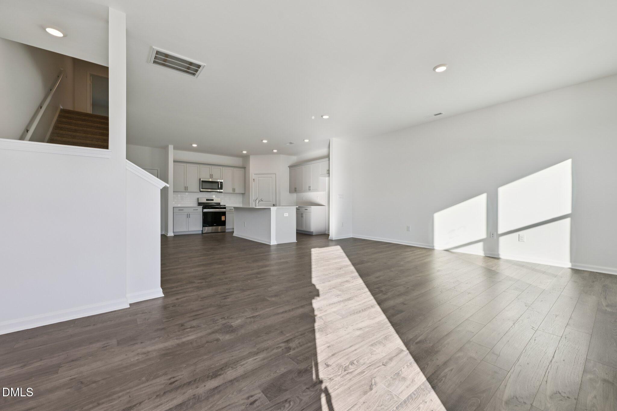 803 Old Tarboro Road Wendell, NC 27591 - Photo 6 of 48 a view of a kitchen with furniture and wooden floor