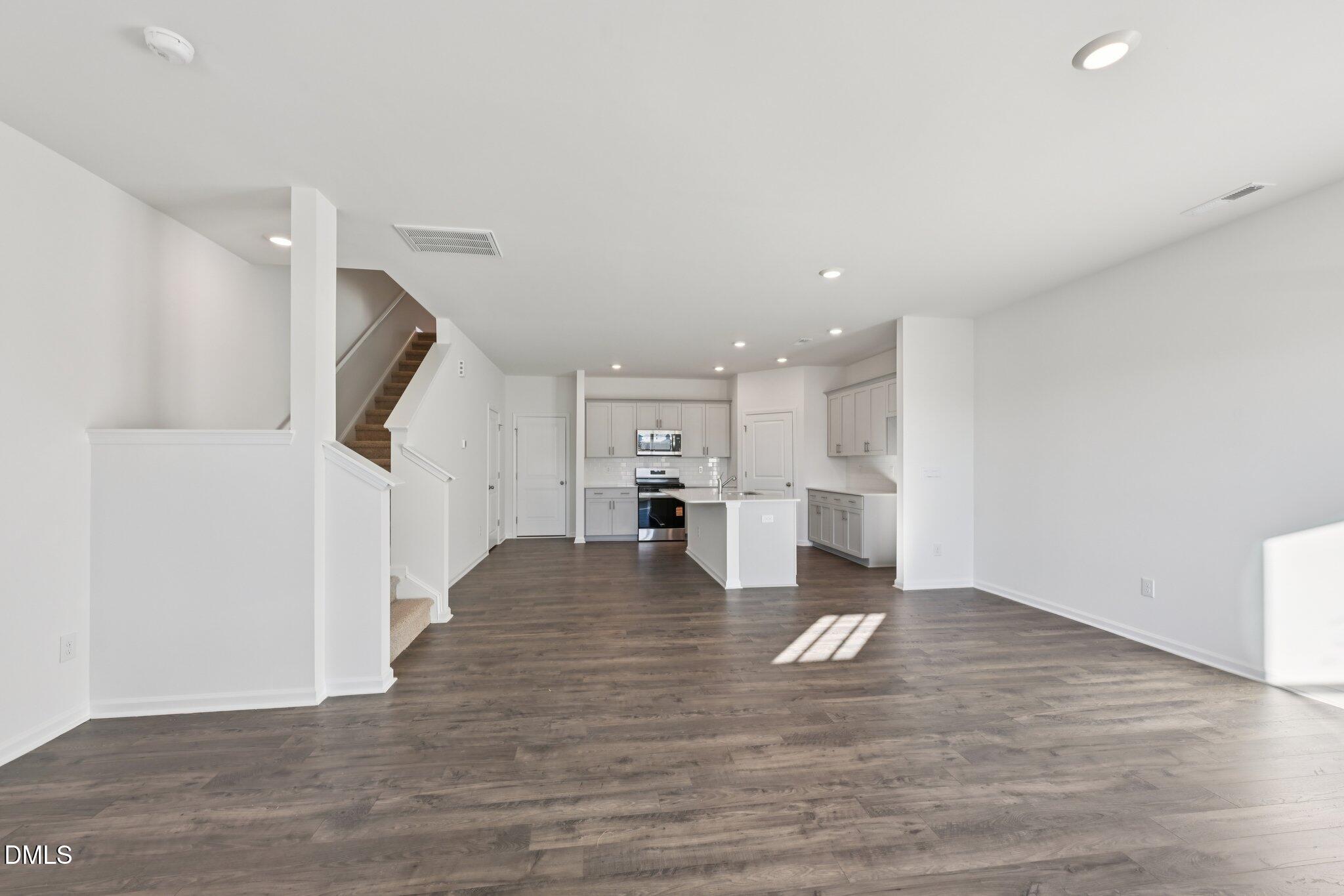 803 Old Tarboro Road Wendell, NC 27591 - Photo 9 of 48 a view of kitchen dining table chairs microwave and cabinets