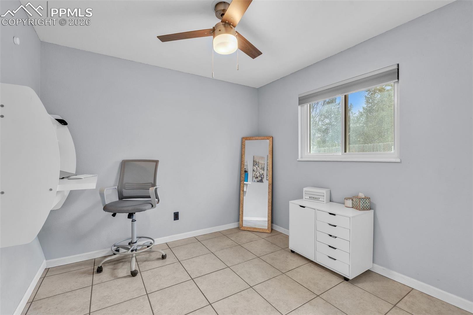 1498 Peterson Road Colorado Springs, CO 80915 - Photo 30 of 44 Office featuring ceiling fan and baseboards