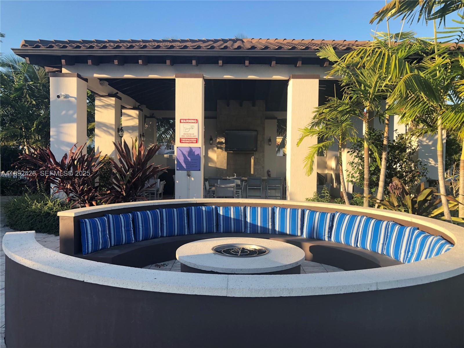 17105 Southwest 96th Street, Unit STUDIO Miami, FL 33196 - Photo 17 of 30 a view of outdoor sitting area with furniture and garden