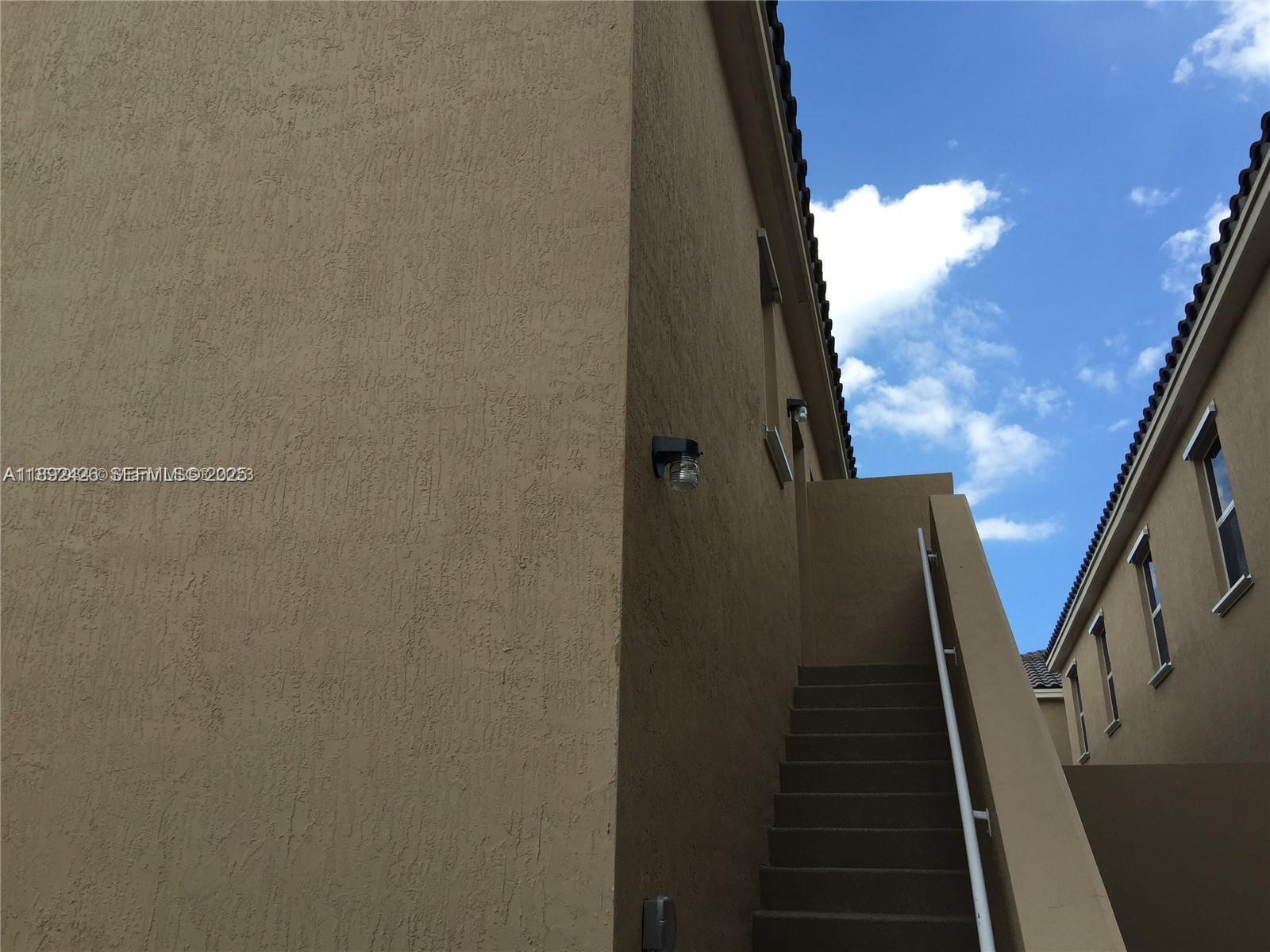 17105 Southwest 96th Street, Unit STUDIO Miami, FL 33196 - Photo 2 of 30 a view of an entryway