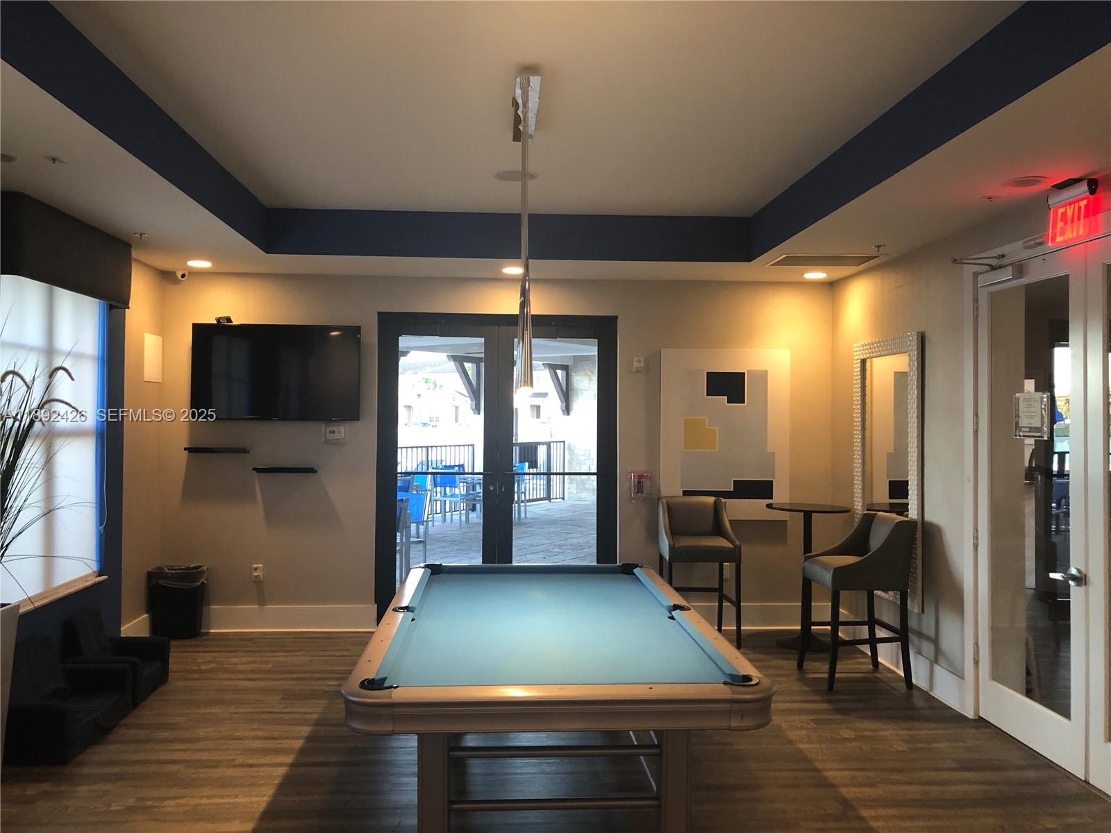 17105 Southwest 96th Street, Unit STUDIO Miami, FL 33196 - Photo 24 of 30 a room with pool table and windows