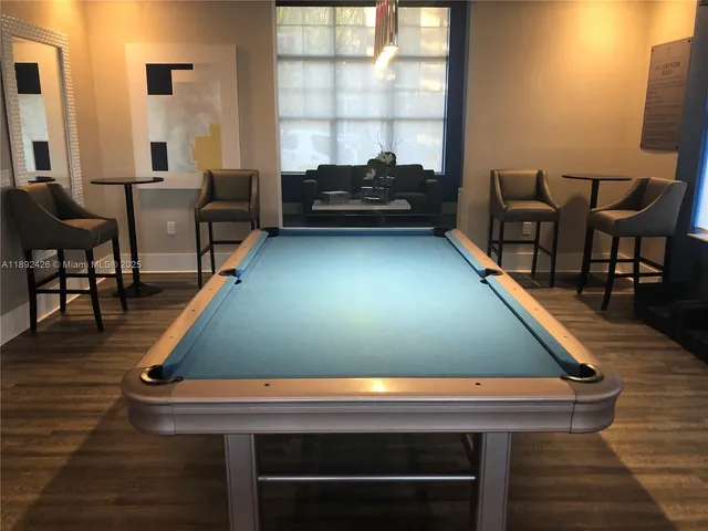 a view of a white house with a large windows