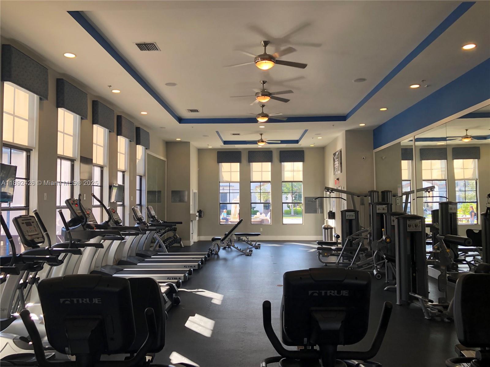 17105 Southwest 96th Street, Unit STUDIO Miami, FL 33196 - Photo 30 of 30 a room with gym equipment and large windows