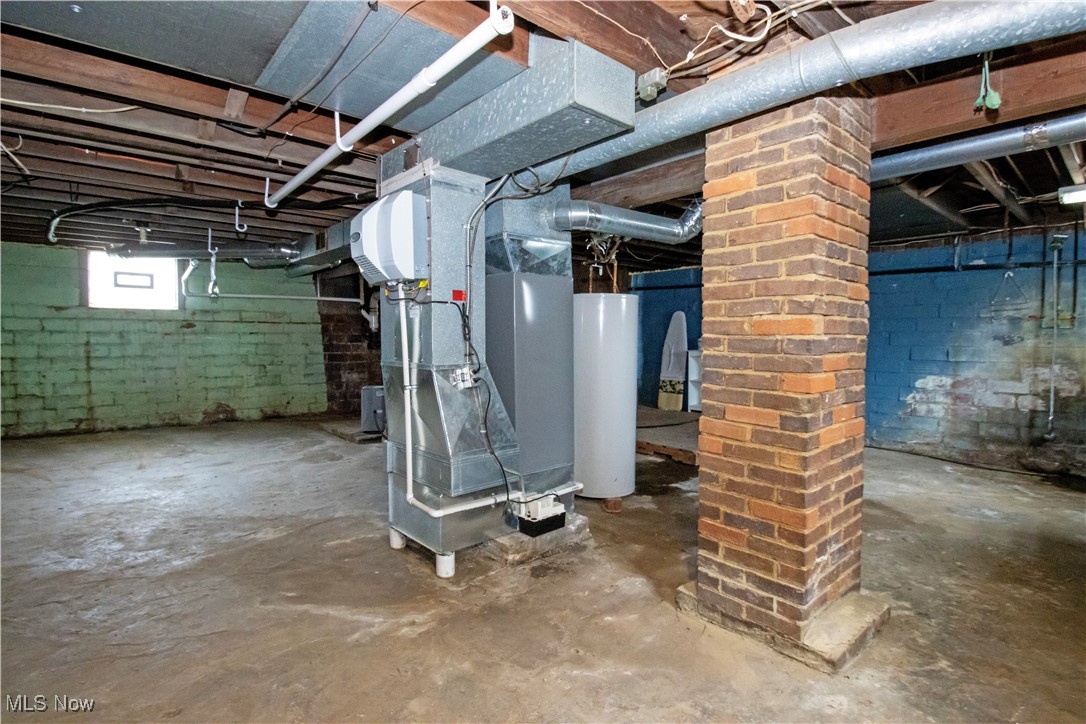 5699 Massillon Road Dalton, OH 44618 - Photo 23 of 24 Basement featuring heating unit and water heater