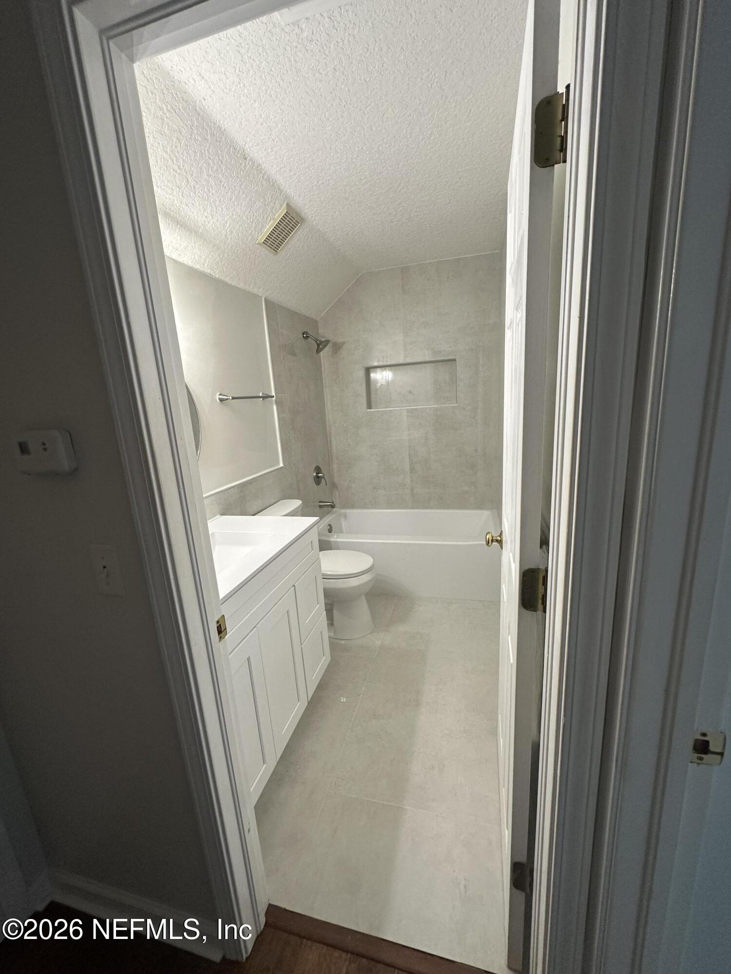 1024 Neptune Lane Neptune Beach, FL 32266 - Photo 51 of 60 a bathroom with a sink a toilet and shower