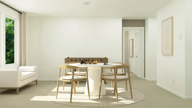 a view of a room with furniture and wooden floor