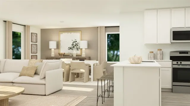 a living room with furniture a flat screen tv and a window