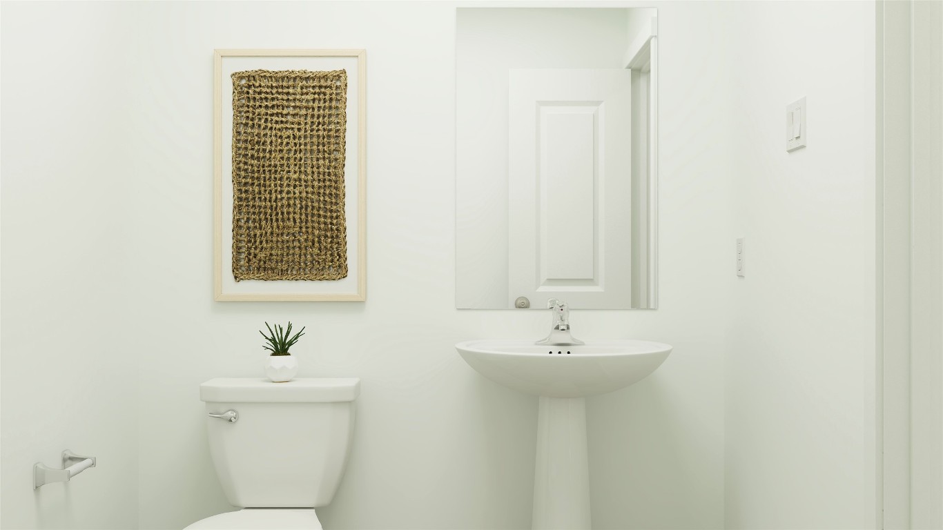 270 Kings Row Lane Jarrell, TX 76537 - Photo 25 of 30 a bathroom with a sink a toilet and a mirror