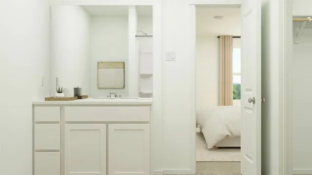 a white toilet sitting next to a shower