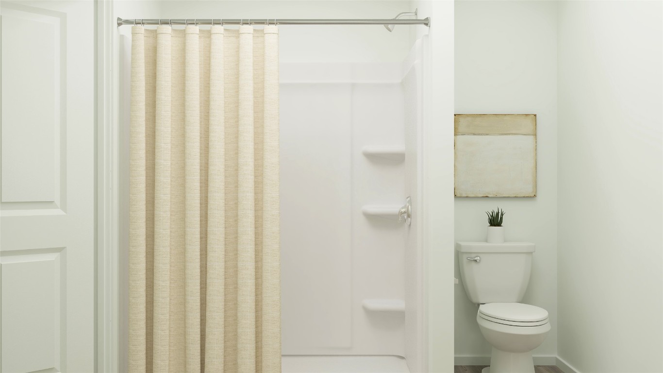 270 Kings Row Lane Jarrell, TX 76537 - Photo 27 of 30 a white toilet sitting next to a shower