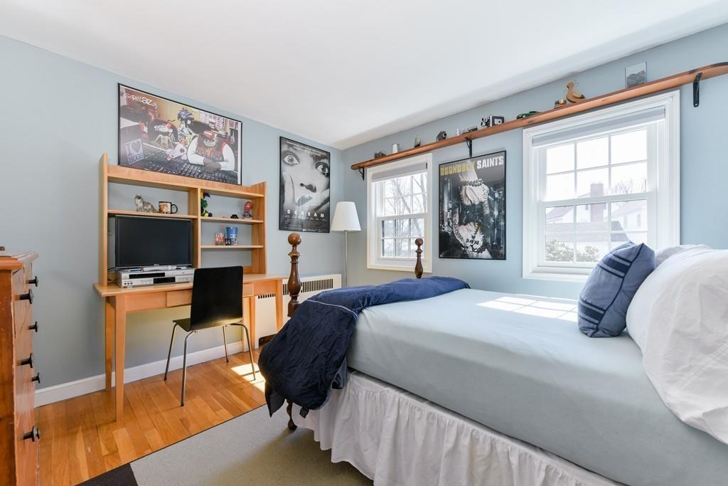 519 Brook Road Milton, MA 02186 - Photo 13 of 19 a bedroom with a bed a couch and large window