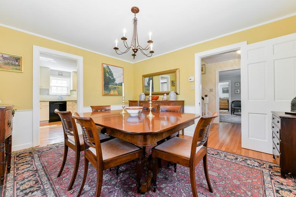 519 Brook Road Milton, MA 02186 - Photo 4 of 19 a view of a dining room with furniture and chandelier