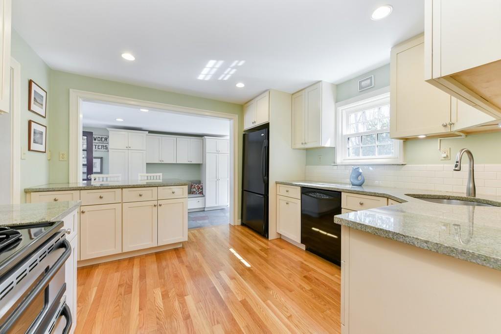519 Brook Road Milton, MA 02186 - Photo 7 of 19 a large kitchen with a stove a sink dishwasher and a refrigerator