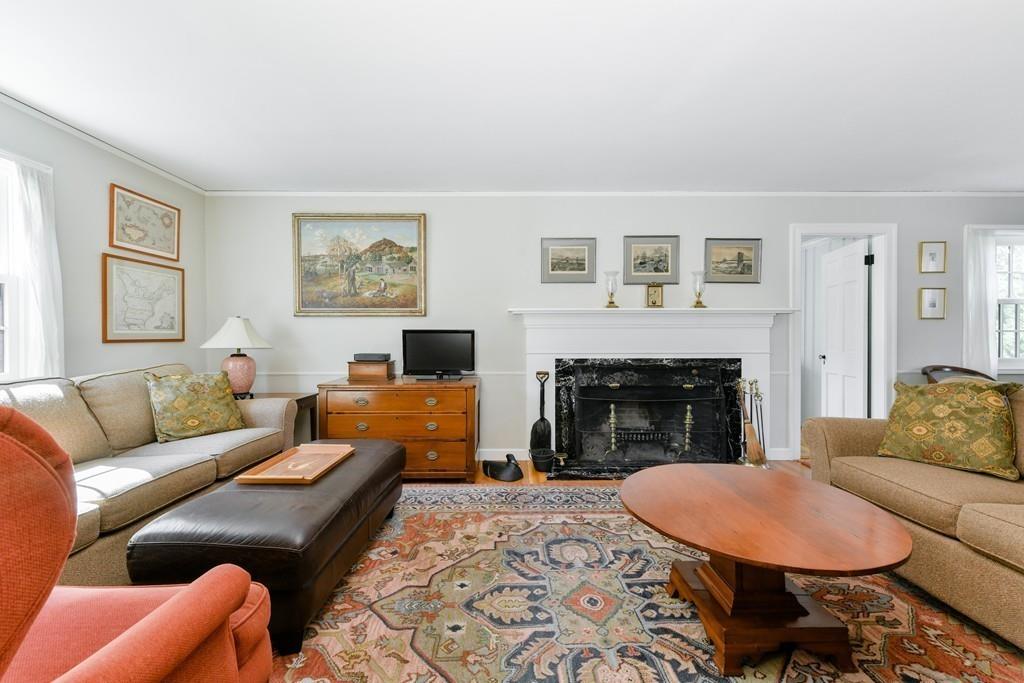 519 Brook Road Milton, MA 02186 - Photo 9 of 19 a living room with furniture and a fireplace