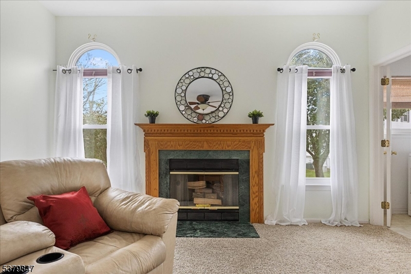 720 Colonial Court Somerville, NJ 08876 - Photo 11 of 33 a living room with furniture and a fireplace