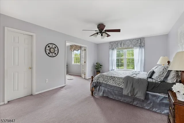 a bed room with a bed and a window