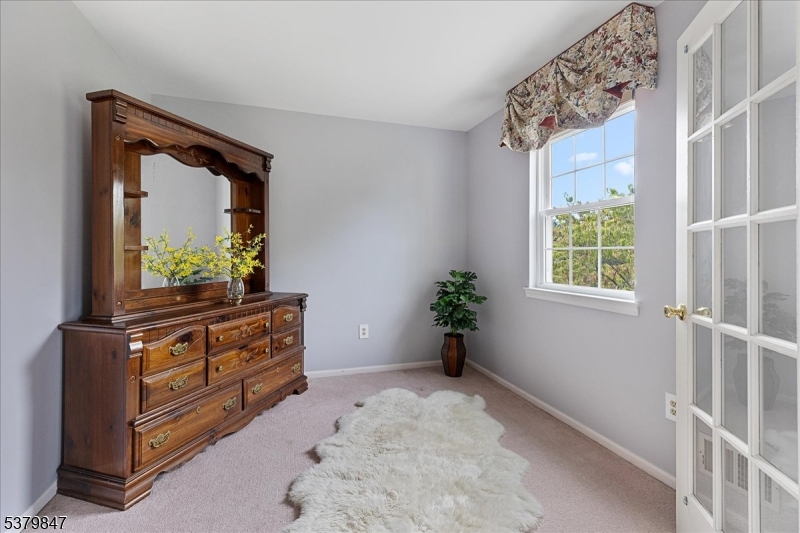 720 Colonial Court Somerville, NJ 08876 - Photo 15 of 33 a living room with furniture and a window