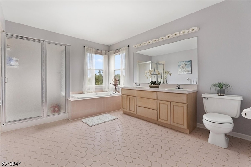 720 Colonial Court Somerville, NJ 08876 - Photo 16 of 33 a bathroom with a toilet sink and mirror