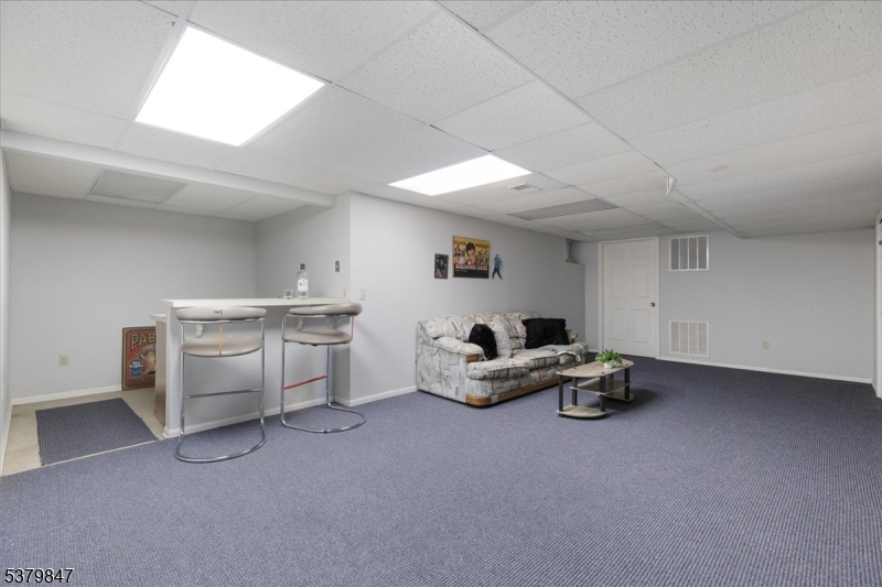 720 Colonial Court Somerville, NJ 08876 - Photo 20 of 33 a living room with furniture and a window