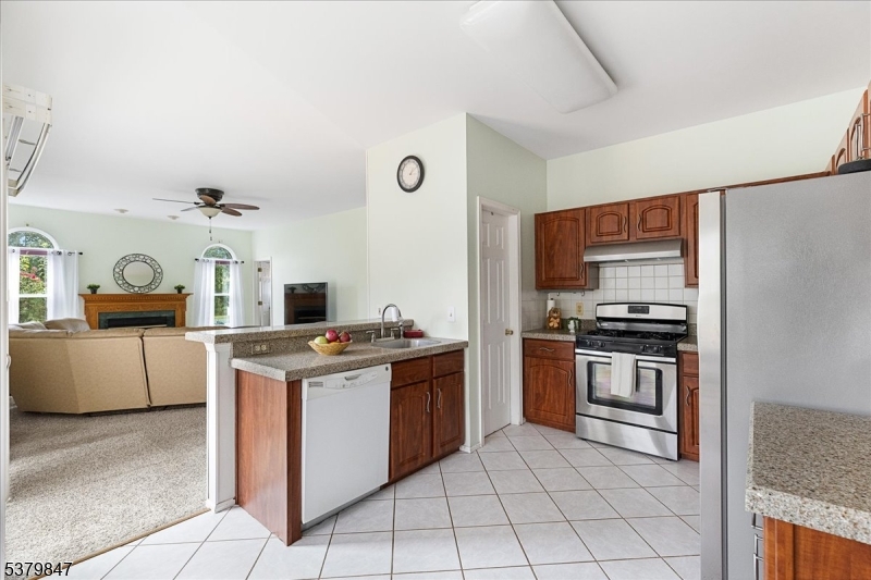 720 Colonial Court Somerville, NJ 08876 - Photo 8 of 33 a kitchen with a stove and a refrigerator