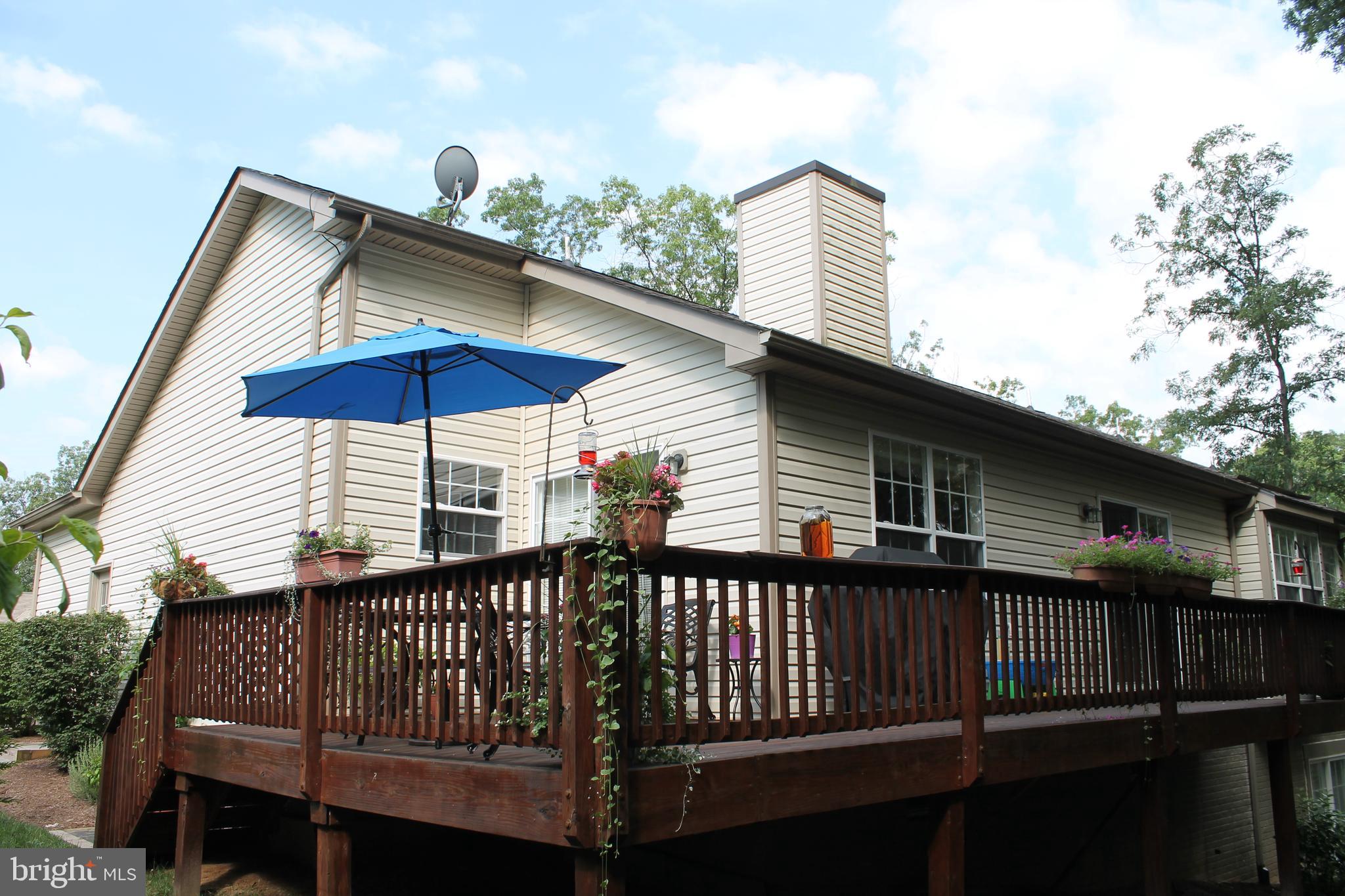 108 Eagle Drive Cross Junction, VA 22625 - Photo 2 of 39 a blue and white umbrella sitting in front of a house