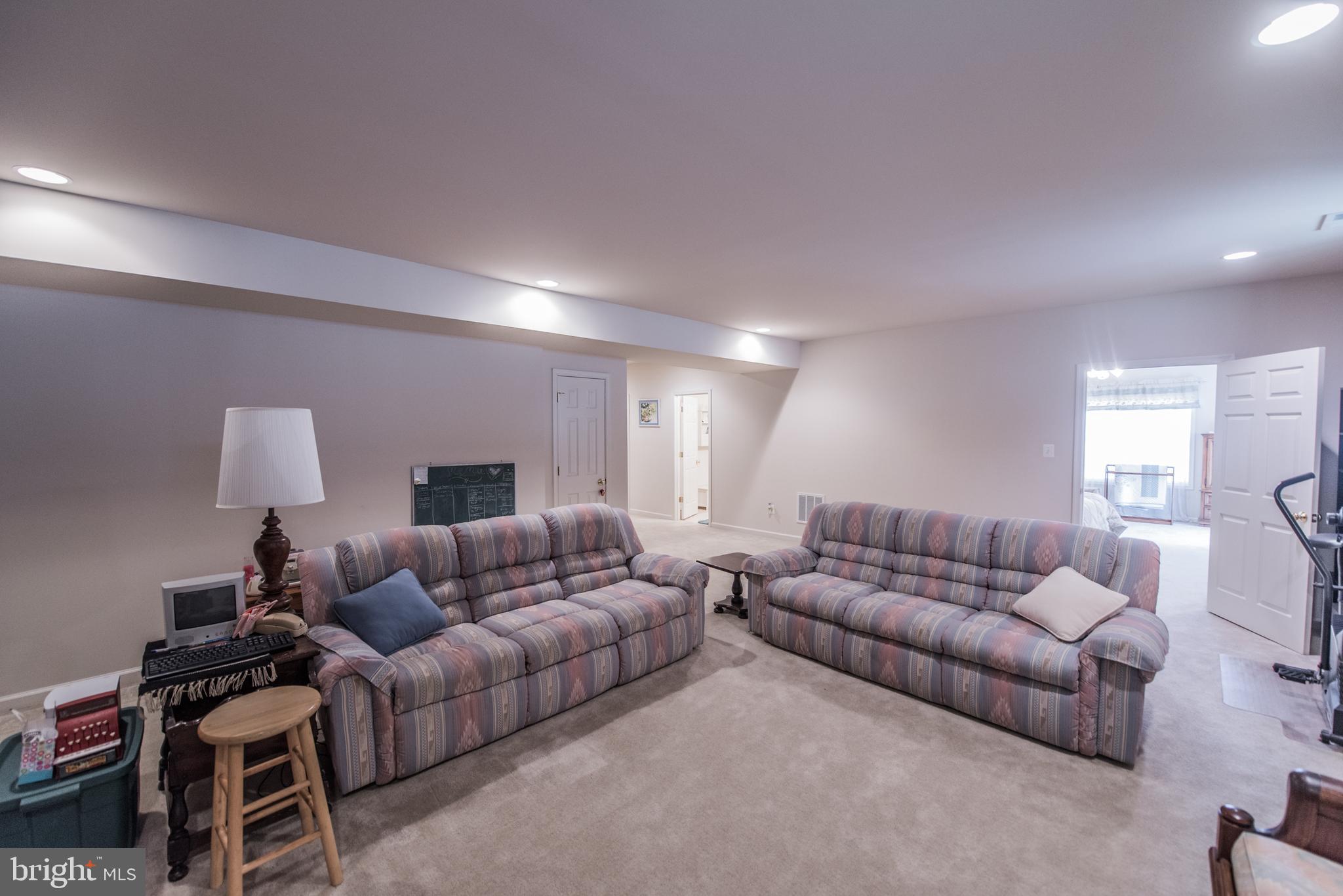 108 Eagle Drive Cross Junction, VA 22625 - Photo 19 of 39 a living room with furniture and a lamp