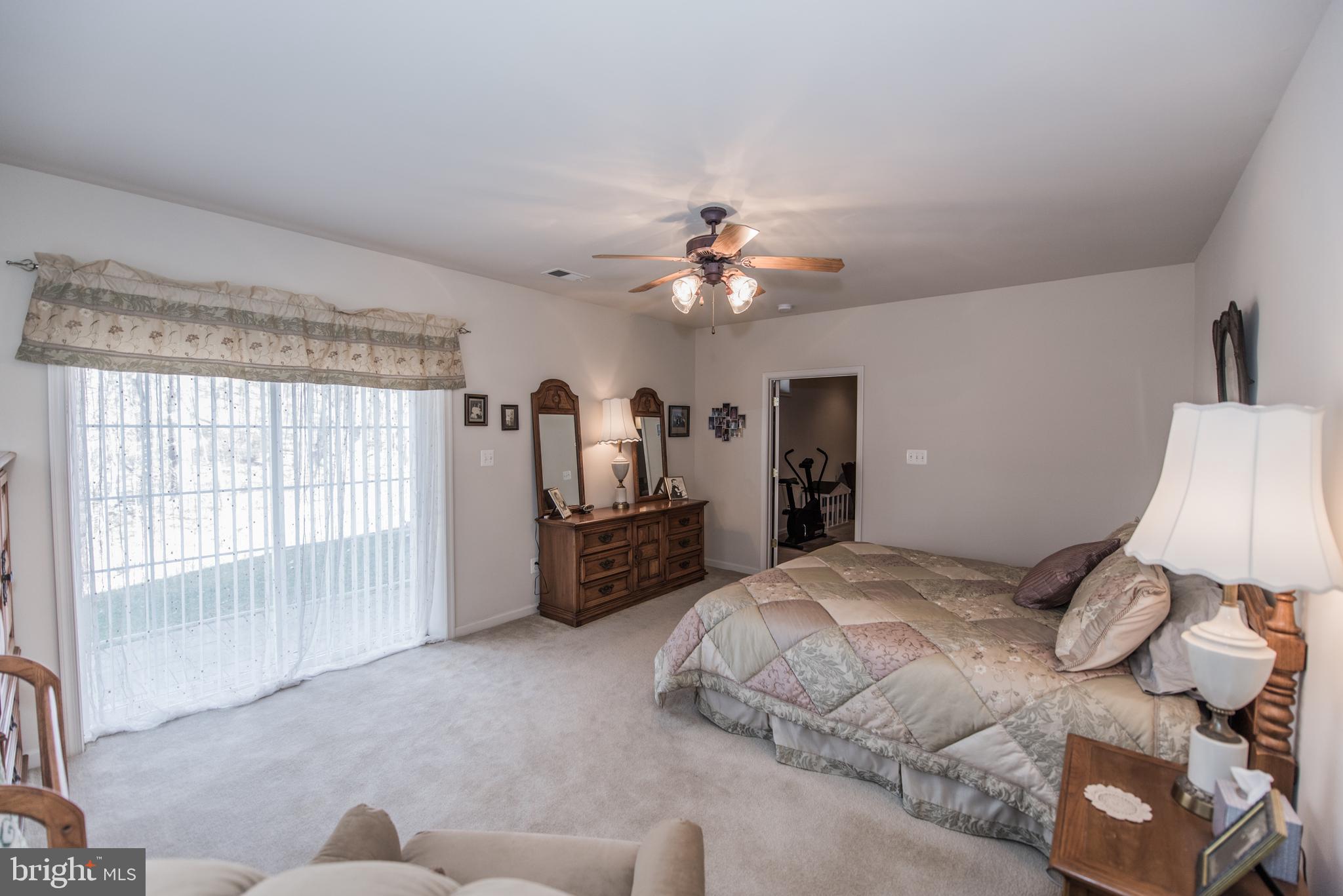 108 Eagle Drive Cross Junction, VA 22625 - Photo 22 of 39 a bedroom with a bed furniture and a large window
