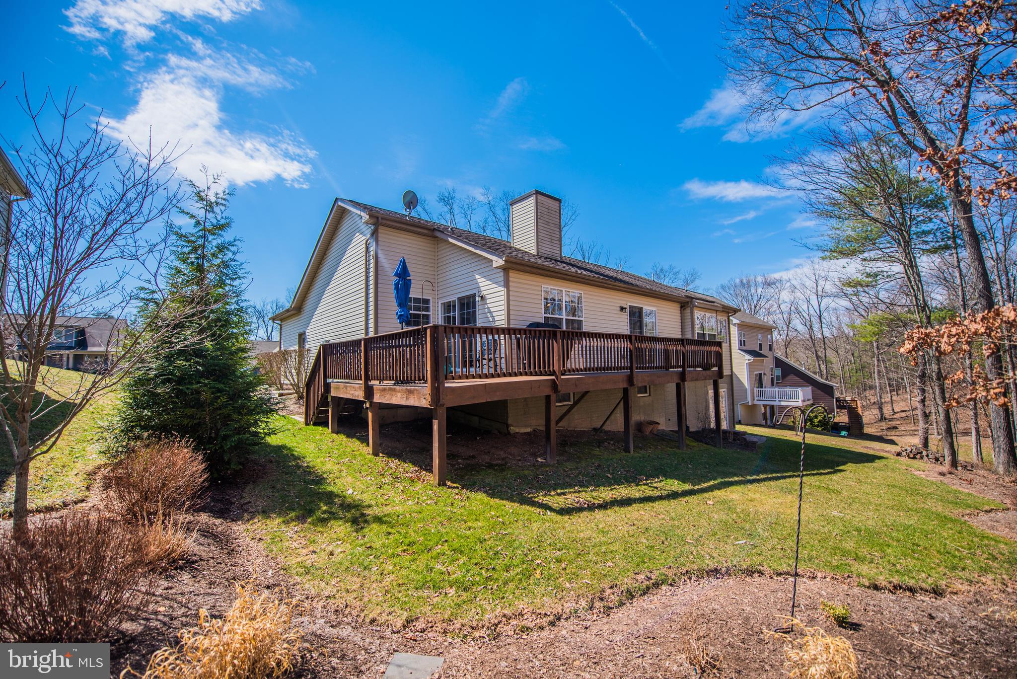 108 Eagle Drive Cross Junction, VA 22625 - Photo 26 of 39 a view of a house with a yard and a wooden deck