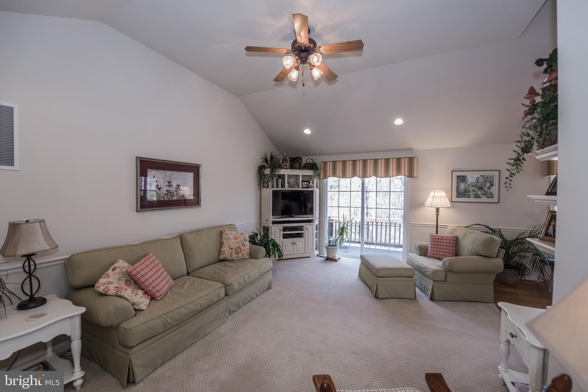 108 Eagle Drive Cross Junction, VA 22625 - Photo 39 of 39 a living room with furniture and a flat screen tv