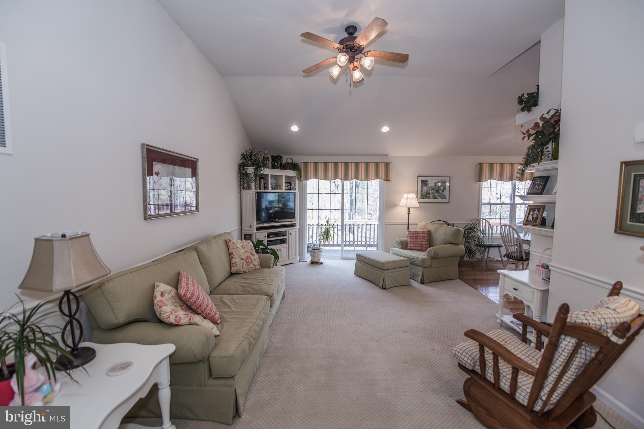 108 Eagle Drive Cross Junction, VA 22625 - Photo 4 of 39 a living room with furniture couches and a flat screen tv