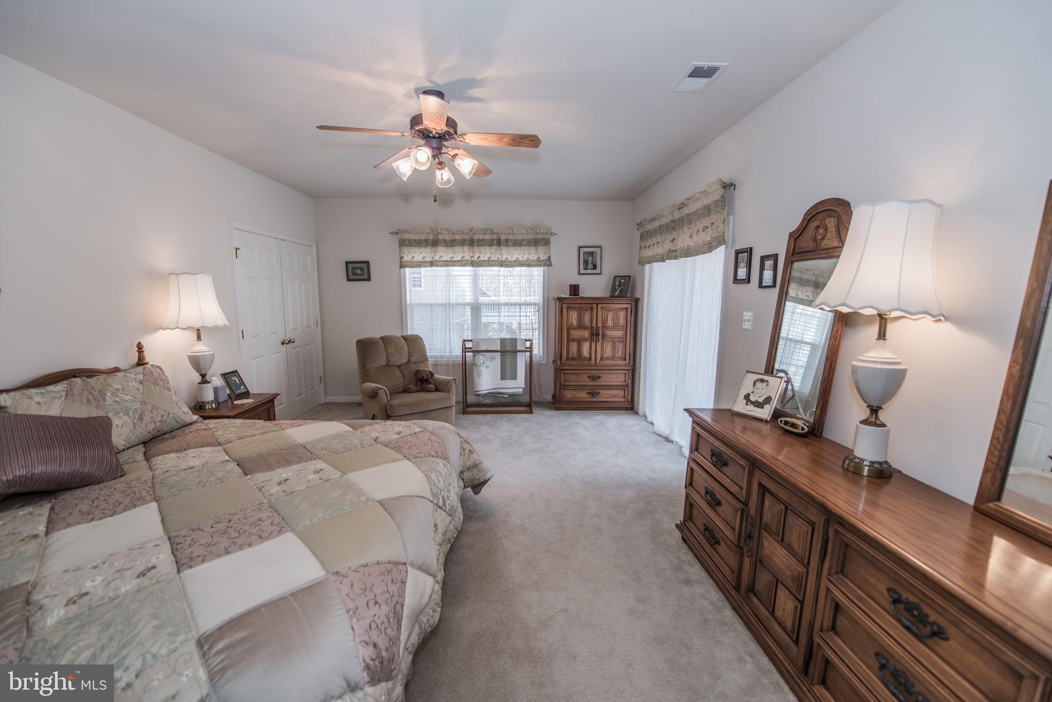 108 Eagle Drive Cross Junction, VA 22625 - Photo 36 of 39 a bed room with furniture and a chandelier