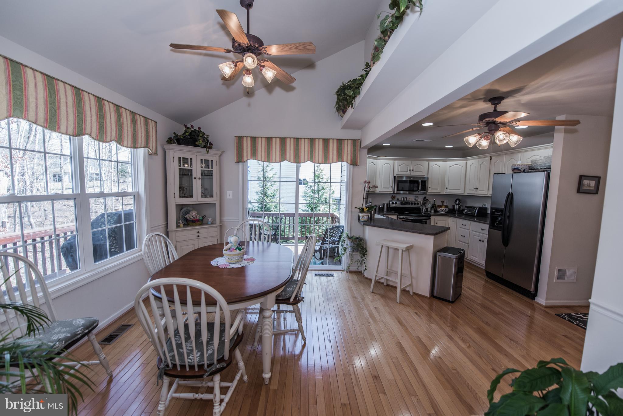 108 Eagle Drive Cross Junction, VA 22625 - Photo 6 of 39 a dining room with furniture a chandelier and wooden floor
