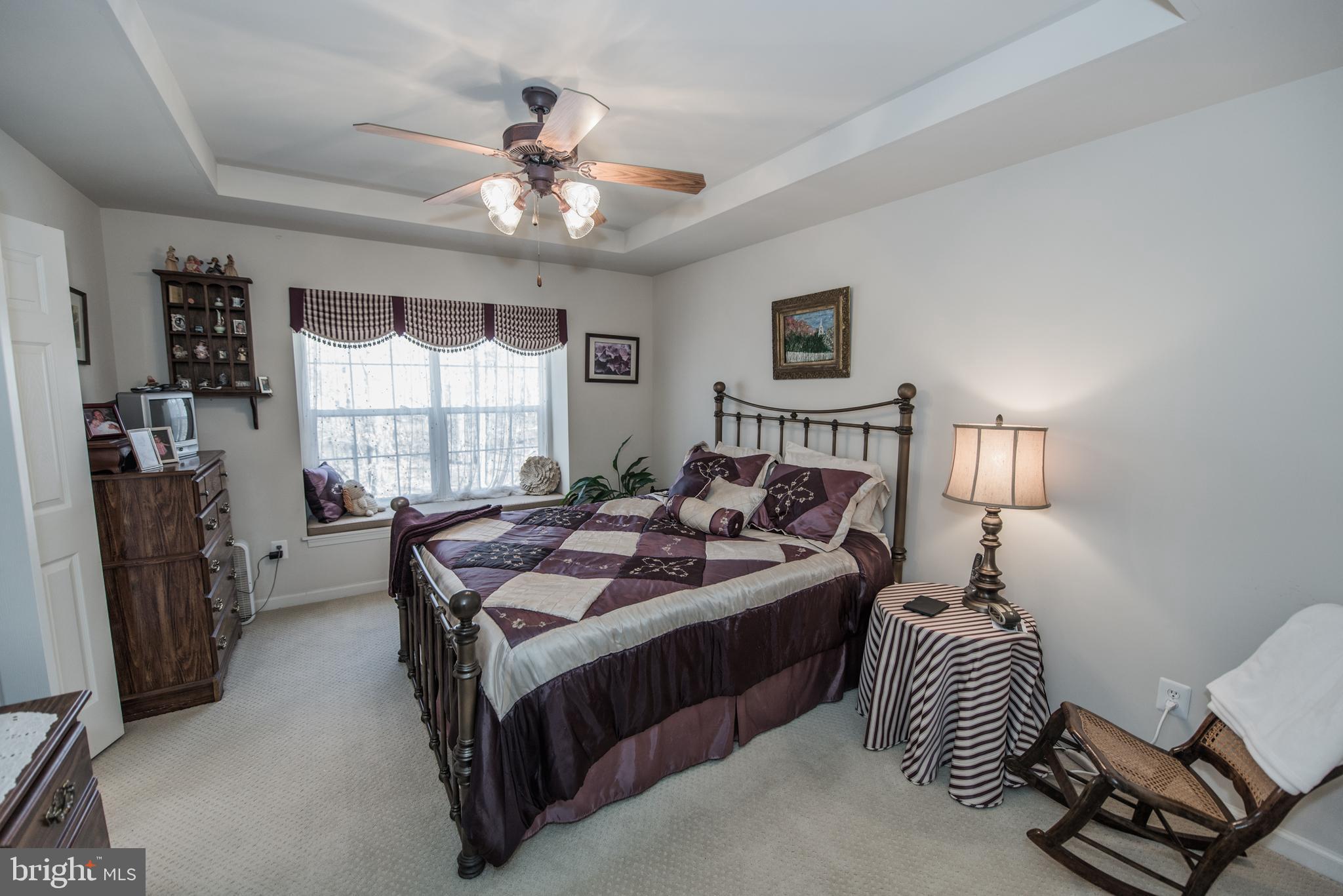 108 Eagle Drive Cross Junction, VA 22625 - Photo 8 of 39 a bedroom with a bed and a chandelier