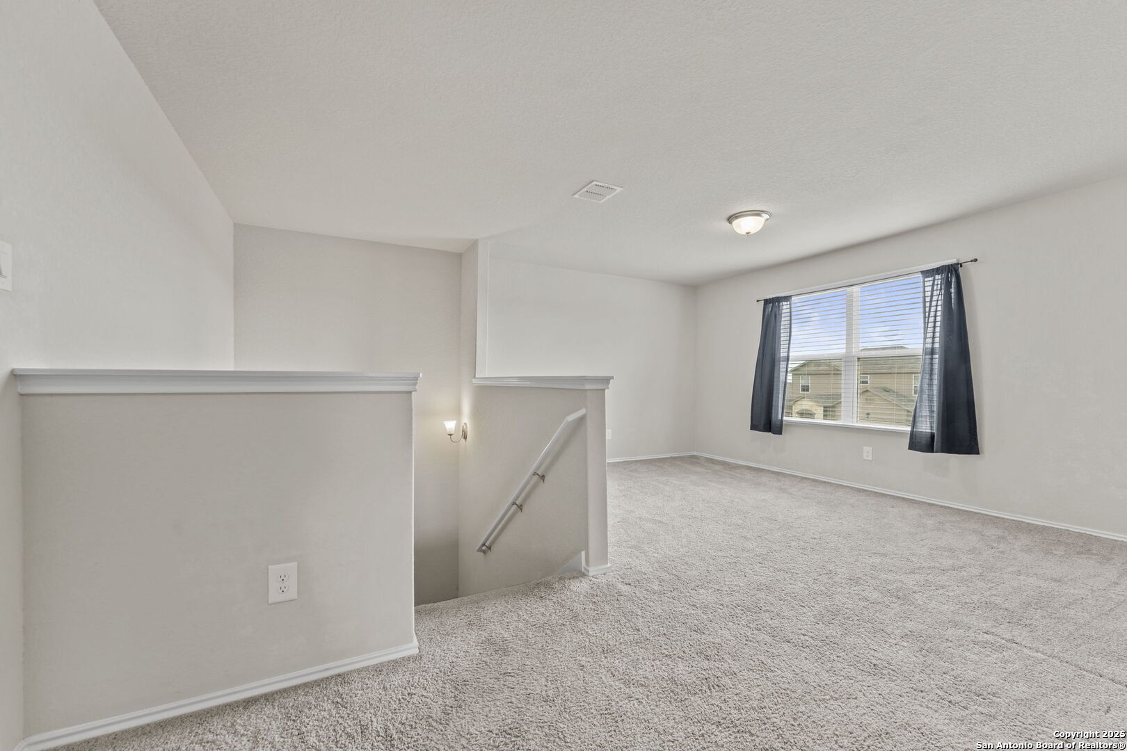 7115 Mesa Cliffs Converse, TX 78109 - Photo 16 of 30 a view of an empty room with a window