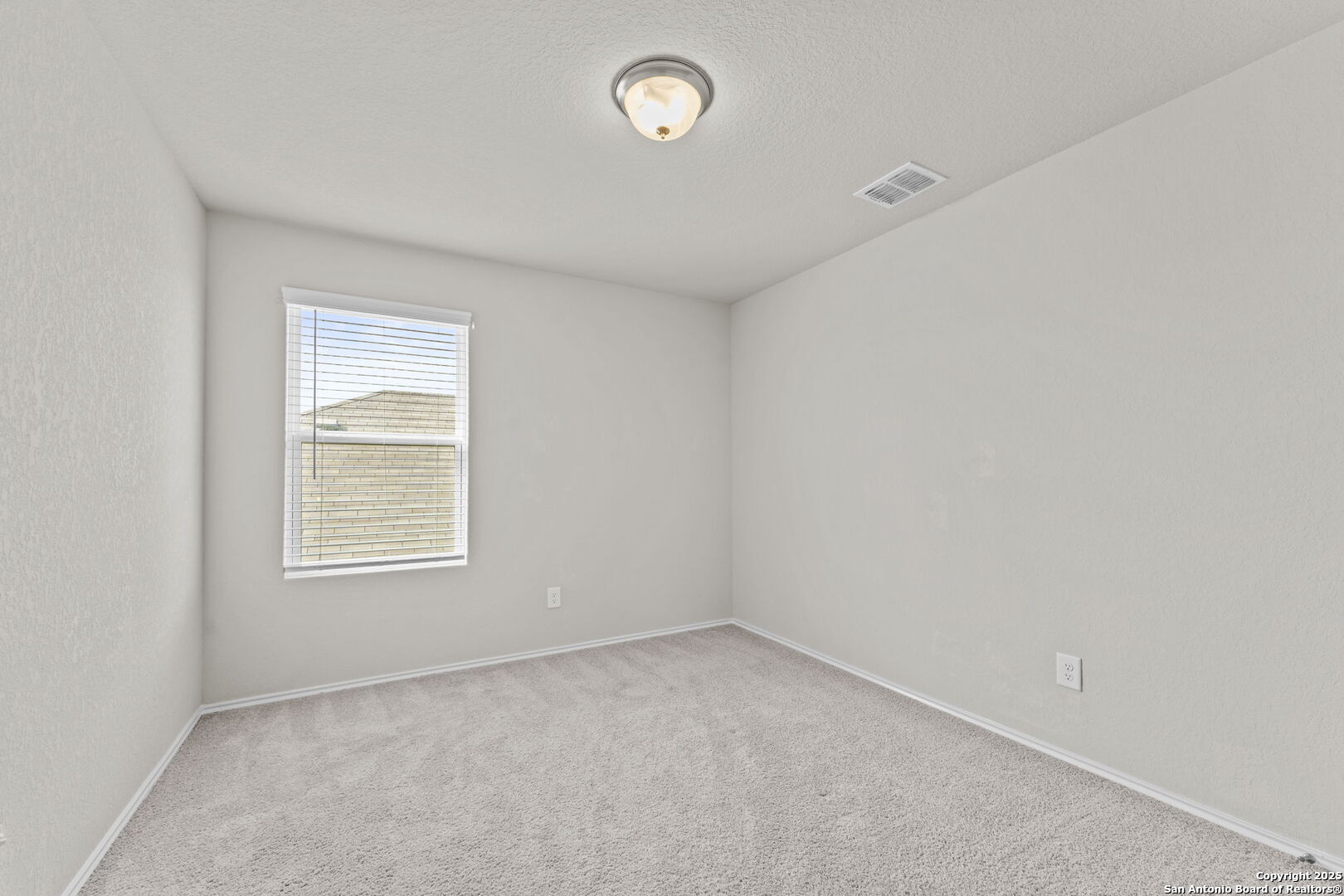 7115 Mesa Cliffs Converse, TX 78109 - Photo 18 of 30 an empty room with a window