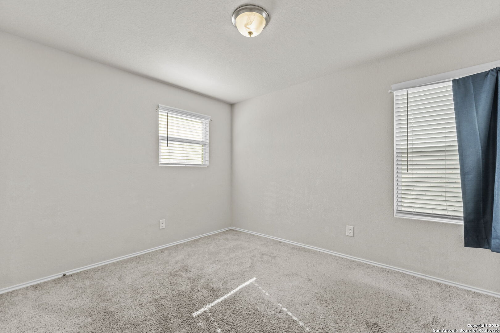 7115 Mesa Cliffs Converse, TX 78109 - Photo 19 of 30 an empty room with windows