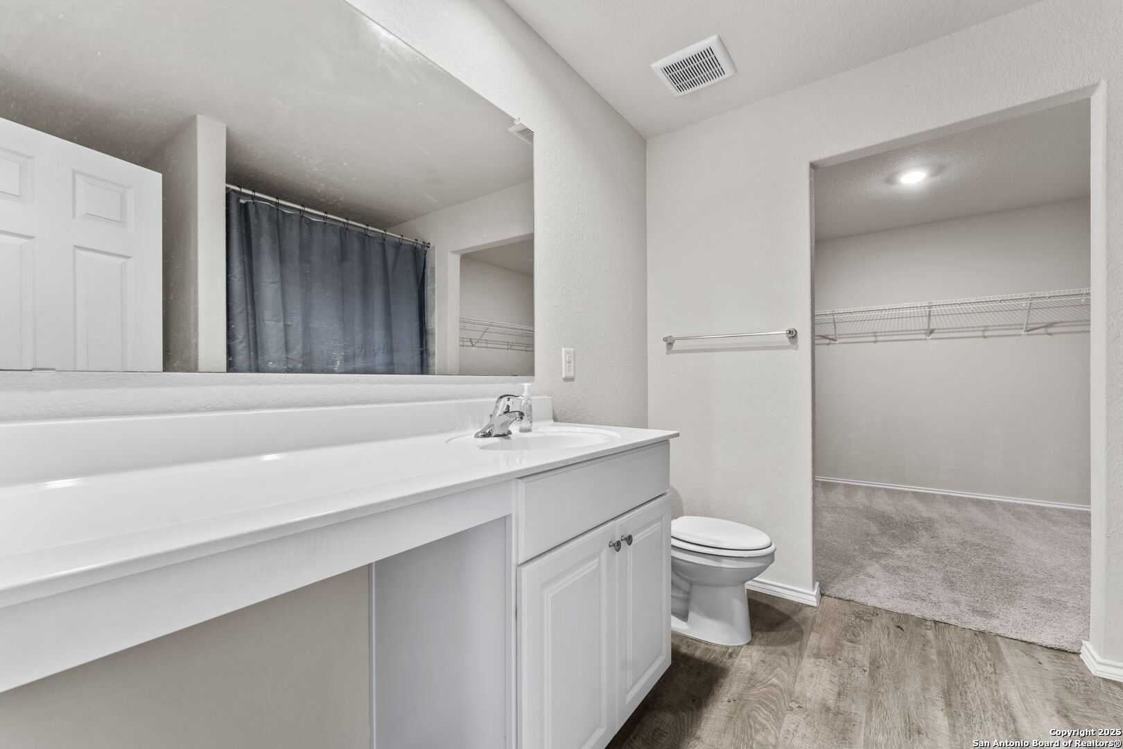 7115 Mesa Cliffs Converse, TX 78109 - Photo 23 of 30 a bathroom with a sink a toilet and shower
