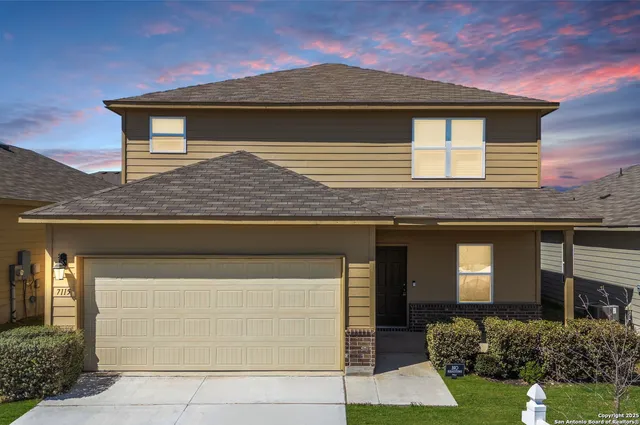 a front view of a house with garage