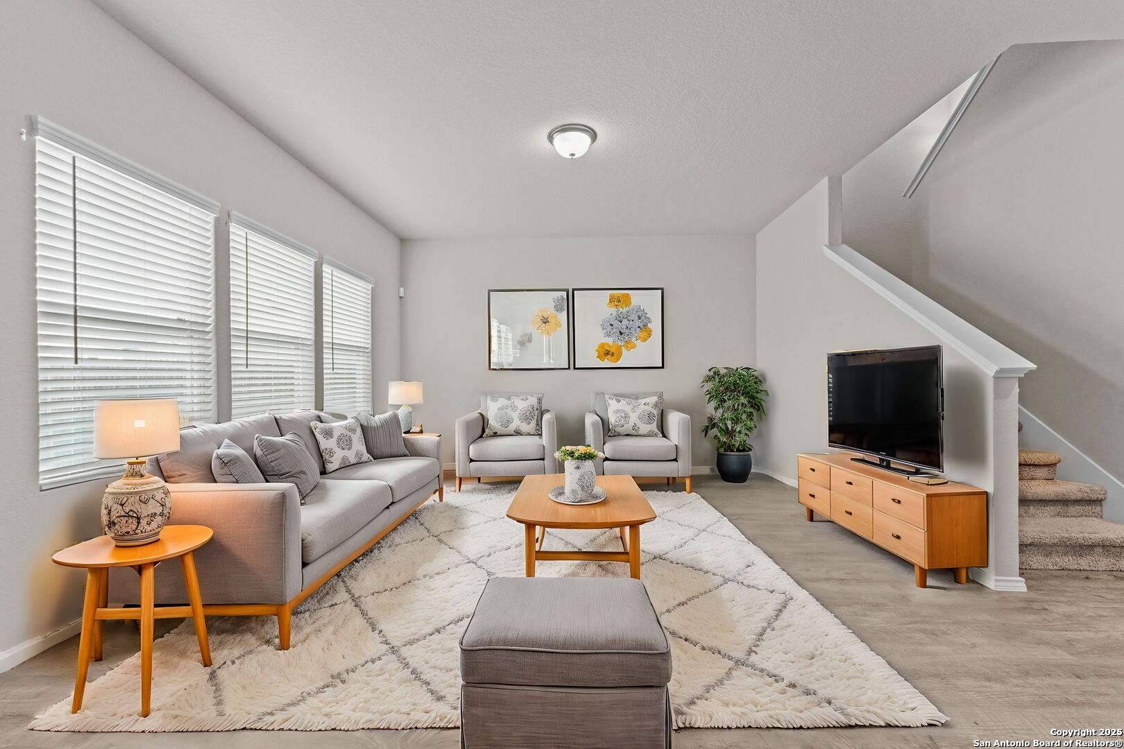 7115 Mesa Cliffs Converse, TX 78109 - Photo 7 of 30 a living room with furniture and a flat screen tv