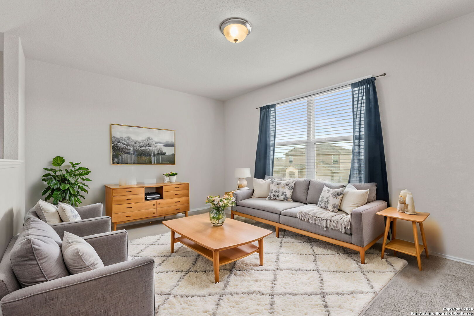 7115 Mesa Cliffs Converse, TX 78109 - Photo 9 of 30 a living room with furniture and a large window